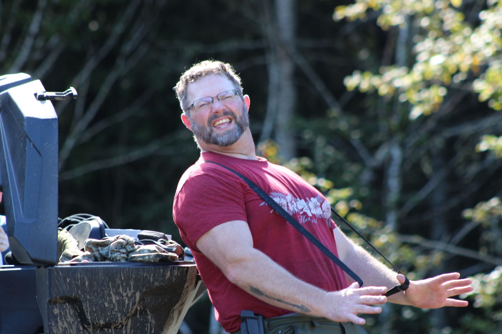 Man leaning back in a relaxed pose outdoors during a natural lifestyle portrait session