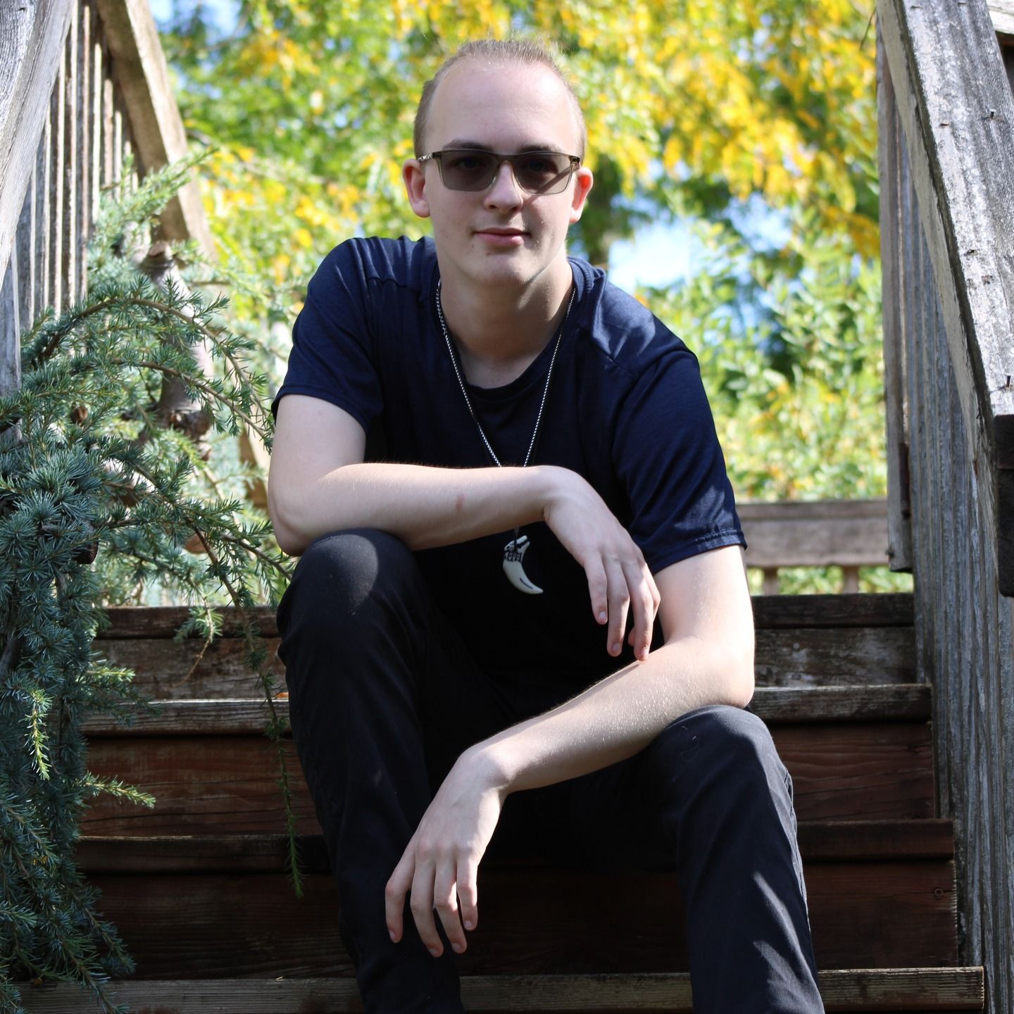 Man sitting on outdoor steps during a relaxed and natural lifestyle portrait session