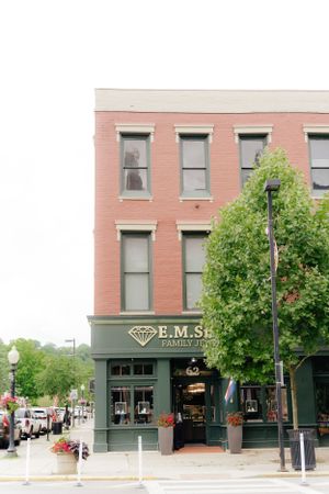 Historic three-story brick building with EMS Family Jewelers storefront.