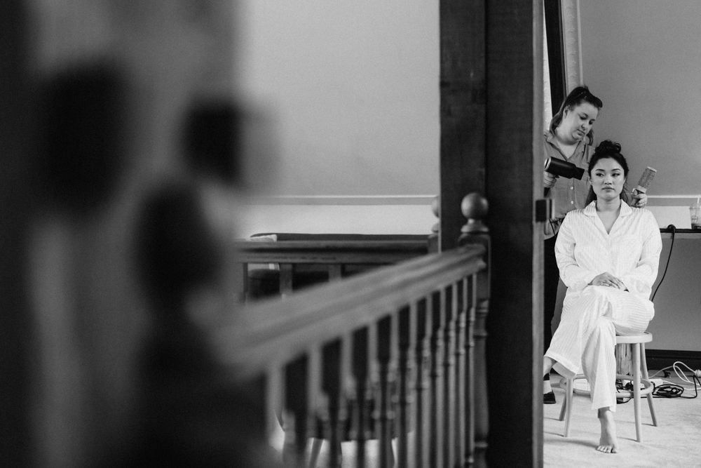 “Bride’s preparations at Maleny Manor, with the Sunshine Coast backdrop, captured in an intimate photography style.”