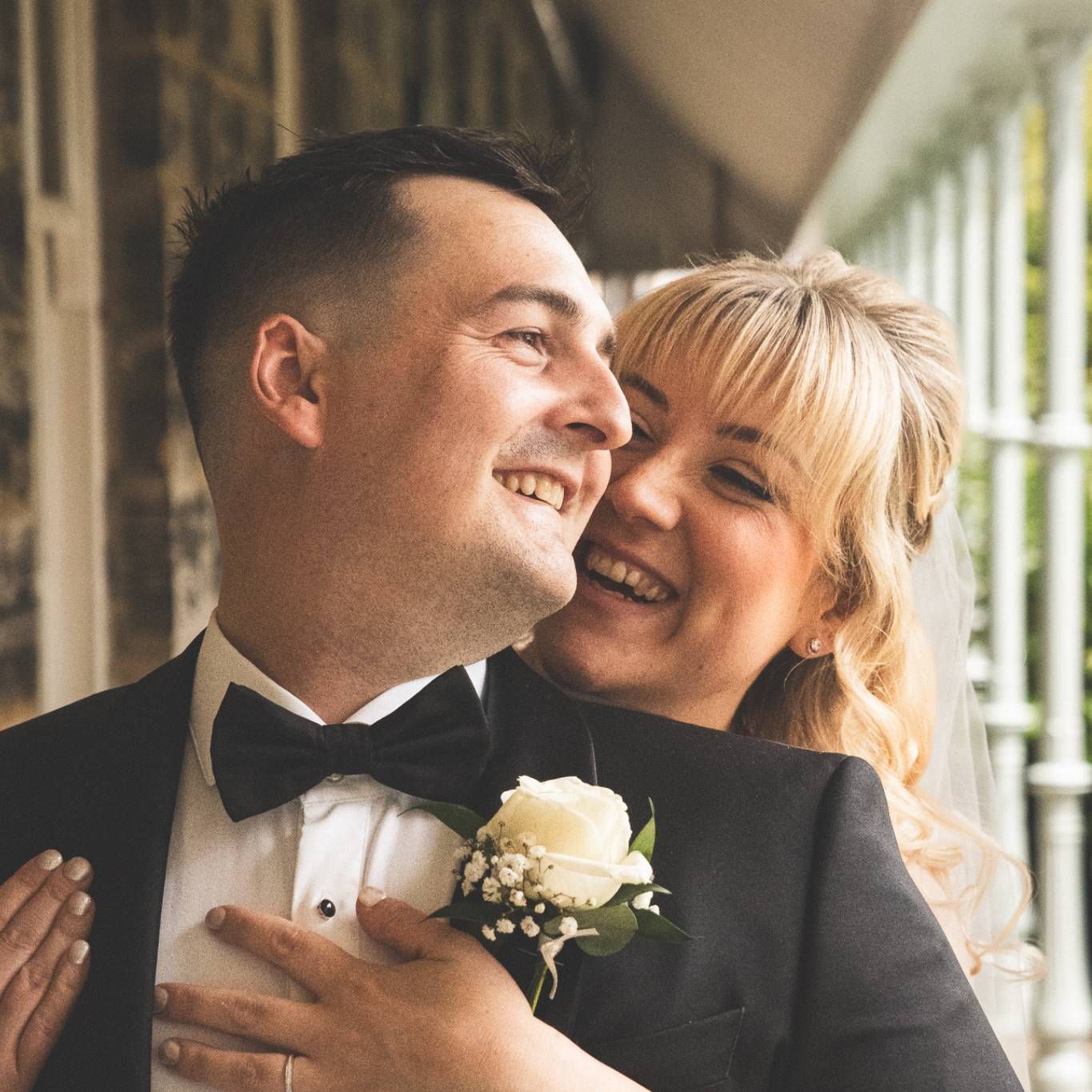 Close-up of a formal couple sharing intimate moments during their wedding celebration.
