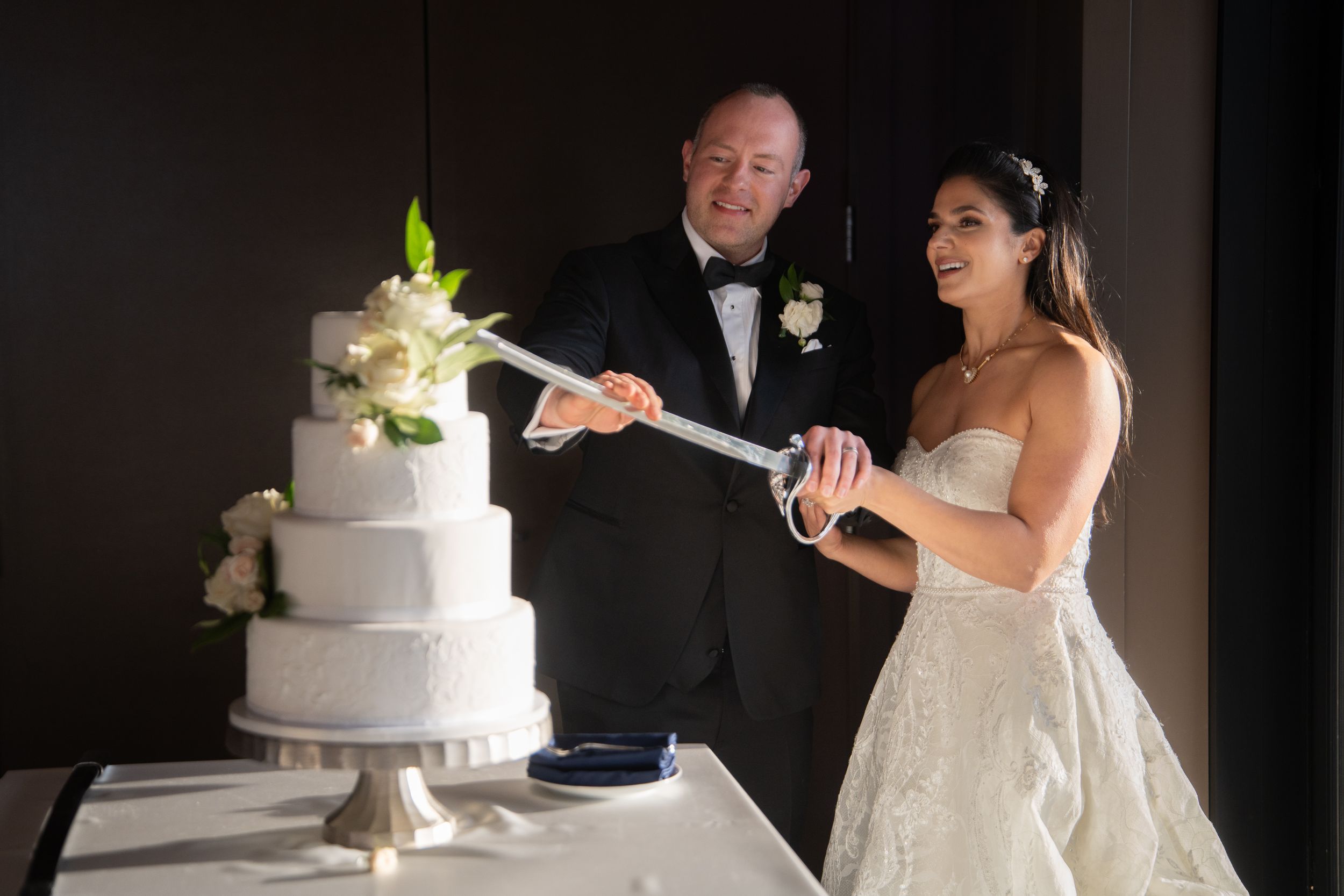 Cake cutting with the sword at the Club at Arrowcreek