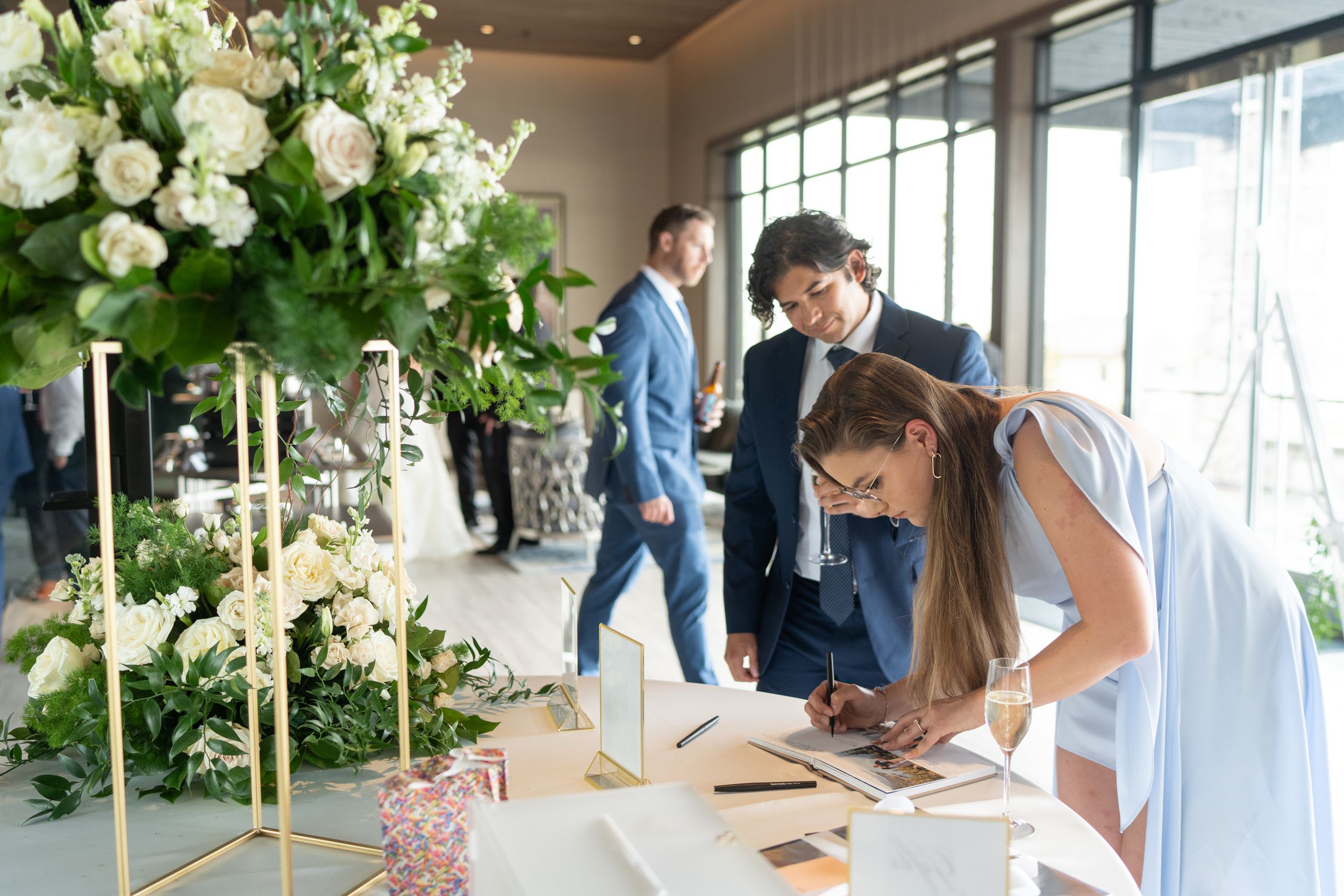Signing wedding guest book at the Club at Arrowcreek