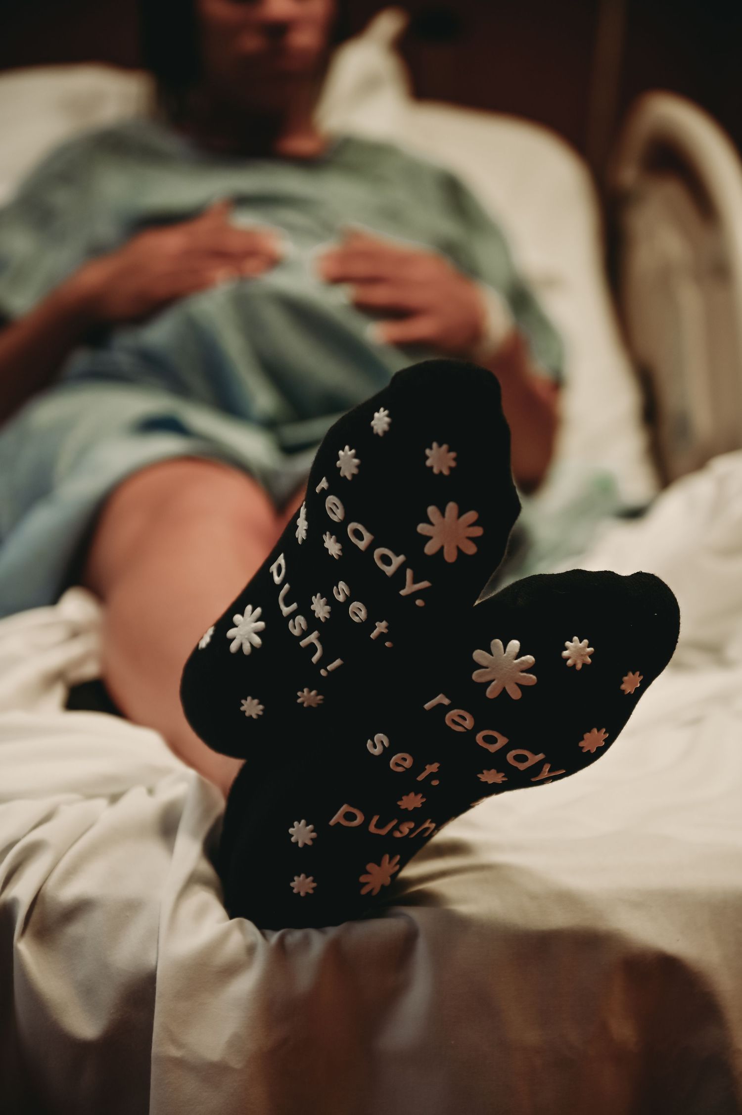 Cozy socks with floral patterns photographed while relaxing on a chair.