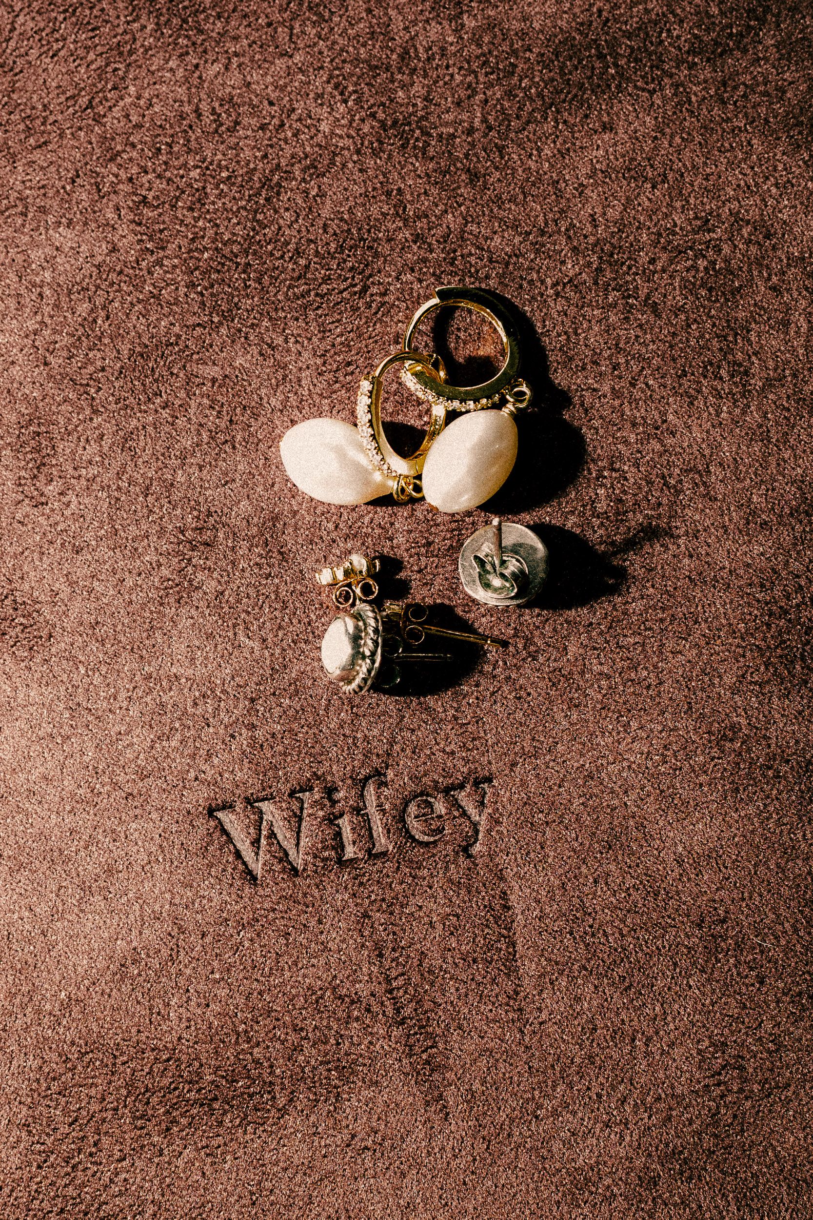 A series of five sepia-toned photographs showing broken eggshells and fragments against a textured dark background.