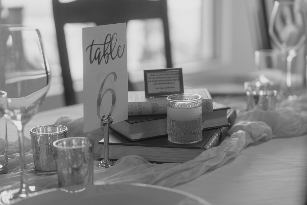 Close-up view of table settings and name cards at a professional business event or conference.