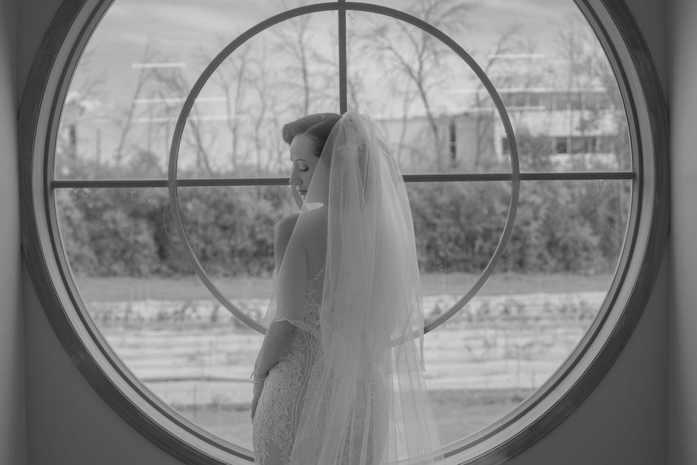 A black and white photo series showing a person looking through a circular window in different poses.