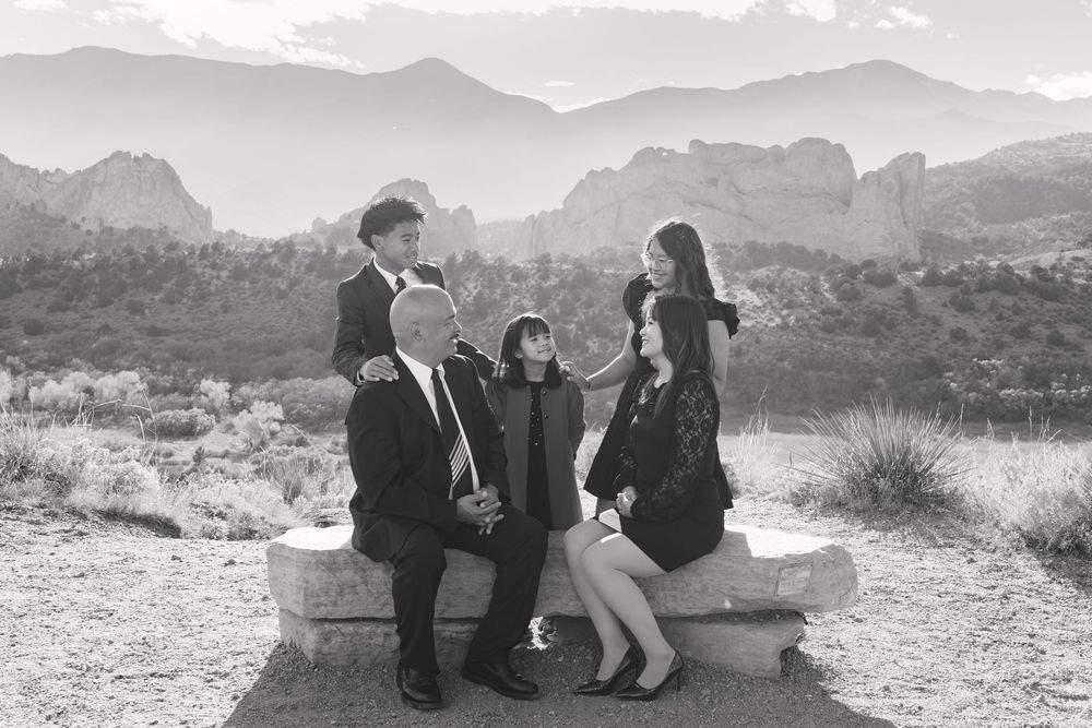 A series of black and white photos showing couples enjoying scenic mountain views at different outdoor locations.