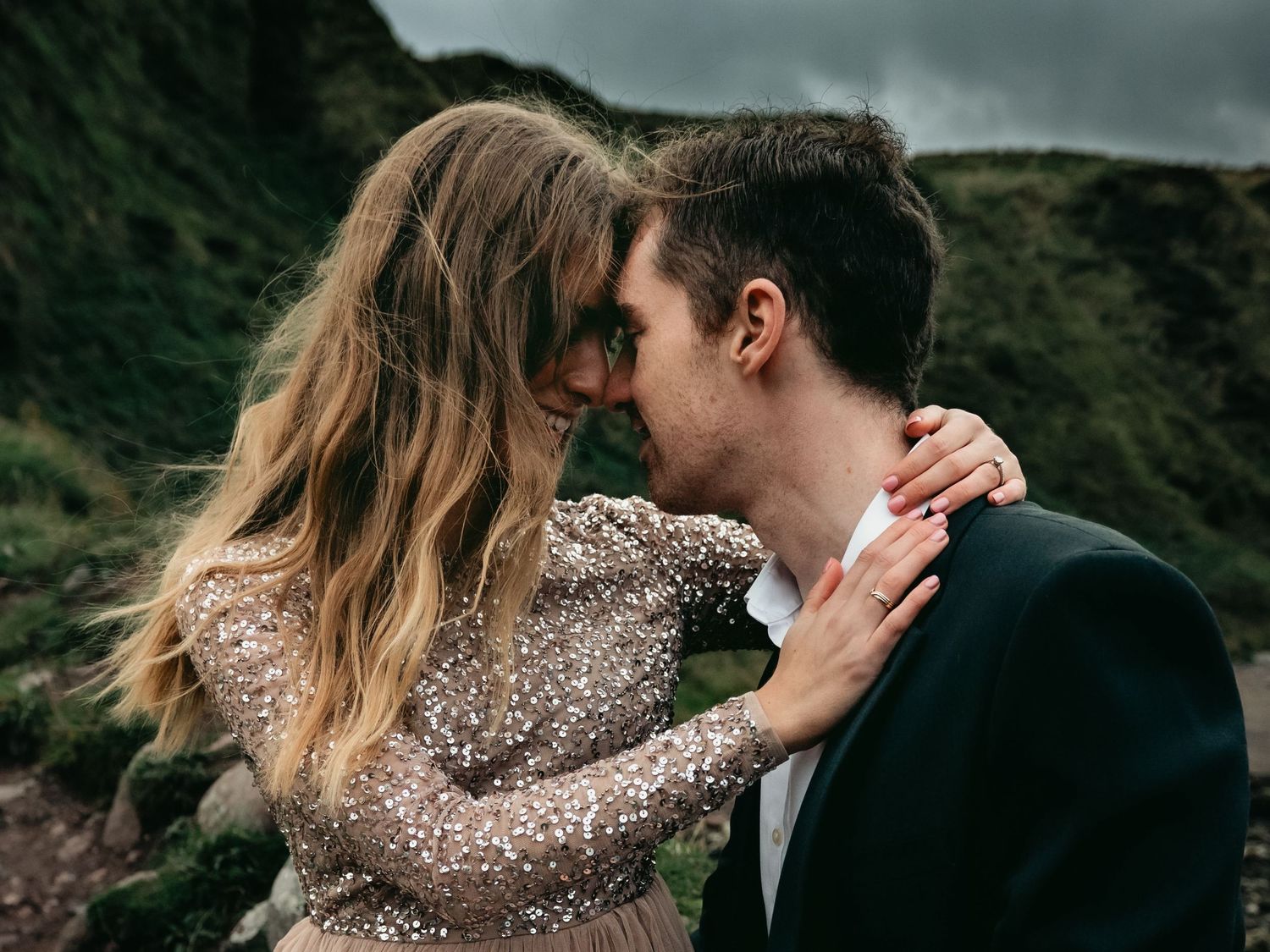 Couple with forheads touching during romantic engagement session.