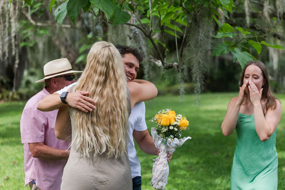 A series of candid photos showing a couple sharing joyful moments and embraces in an outdoor garden setting.