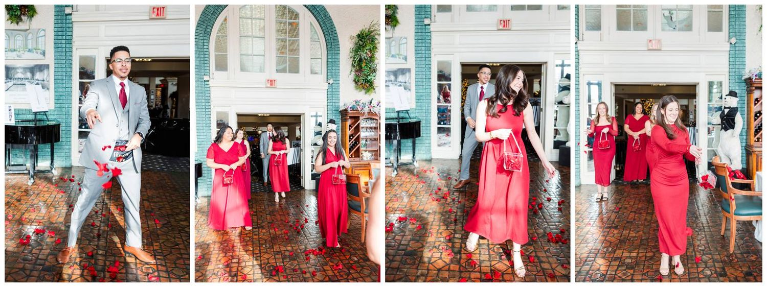 Wedding party in vibrant red dresses poses outdoors for formal photographs.