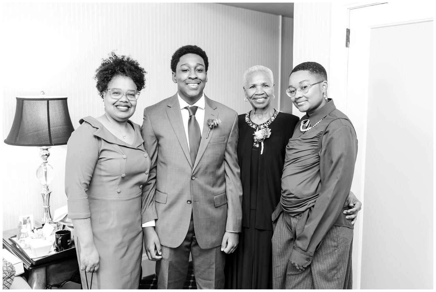 A black and white photo collage showing people in formal attire smiling and posing together at an event.