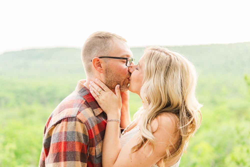 going in for a kiss engagement session