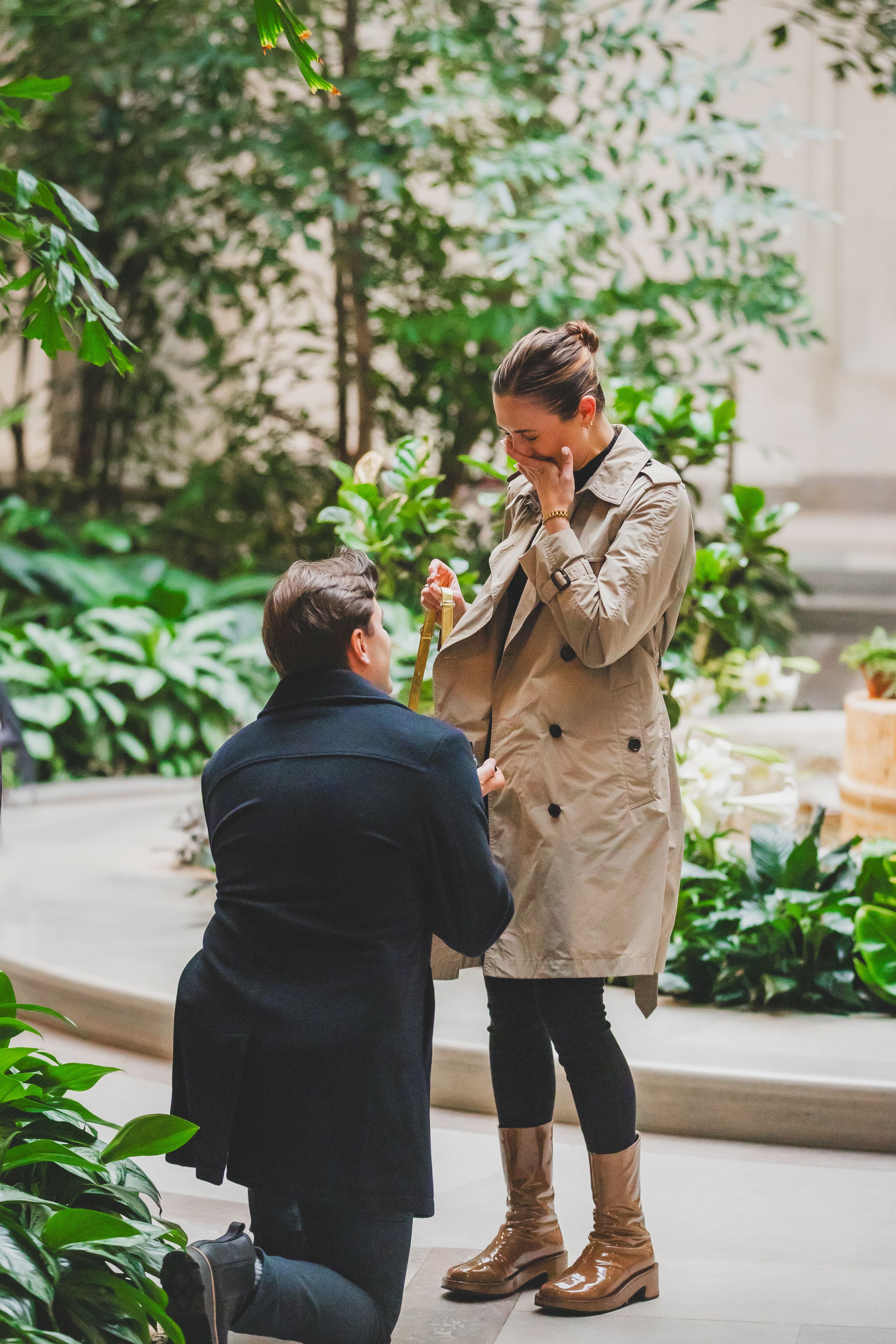 A romantic marriage proposal moment captured in a series of four progressive shots in an outdoor courtyard setting.