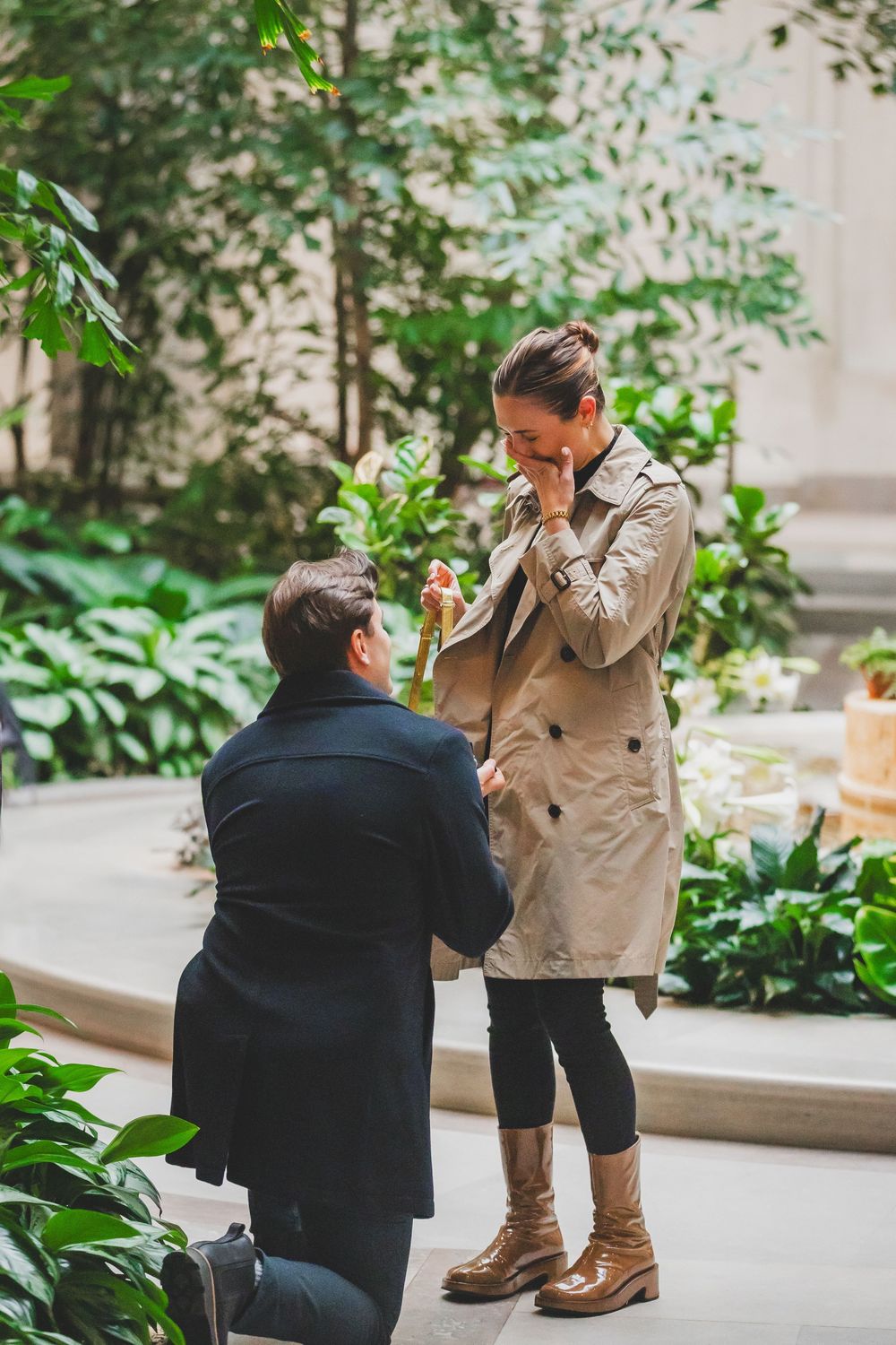 A romantic marriage proposal moment captured in a series of four progressive shots in an outdoor courtyard setting.