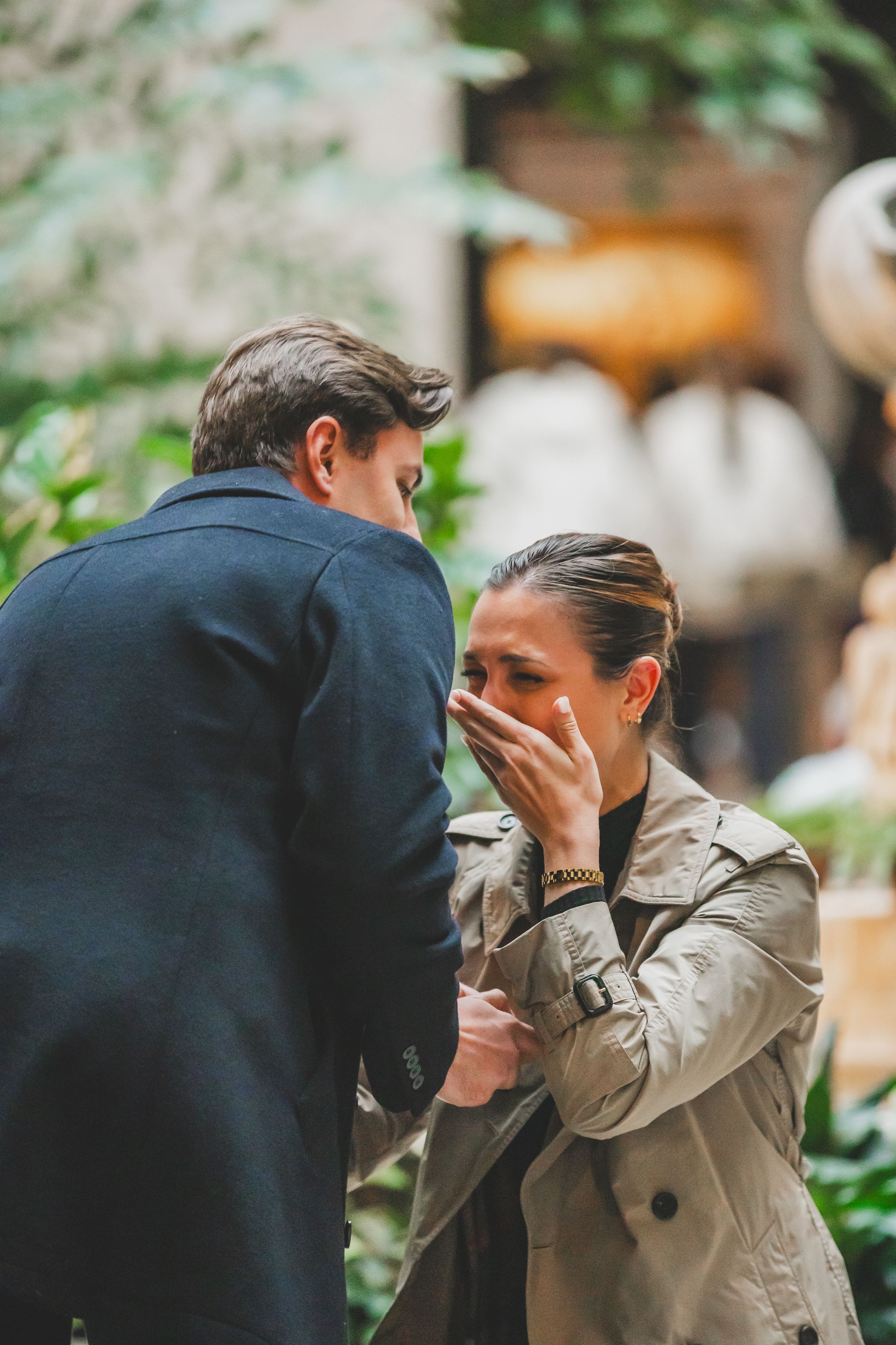 Proposal moment during an intimate moment together in a garden setting at the National Gallery Of Art