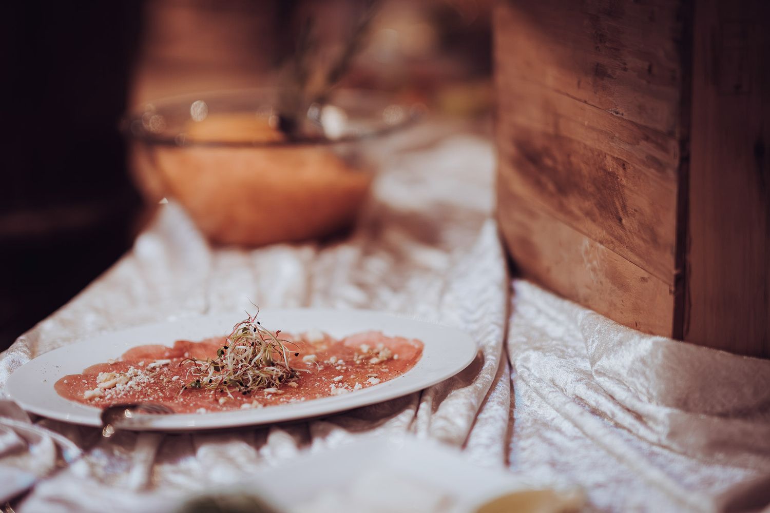 Close-up shots of food being prepared on a rustic wooden table.