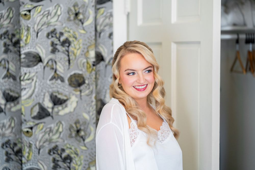 A bright interior space features a decorative gray and yellow wallpaper pattern alongside white trim details.