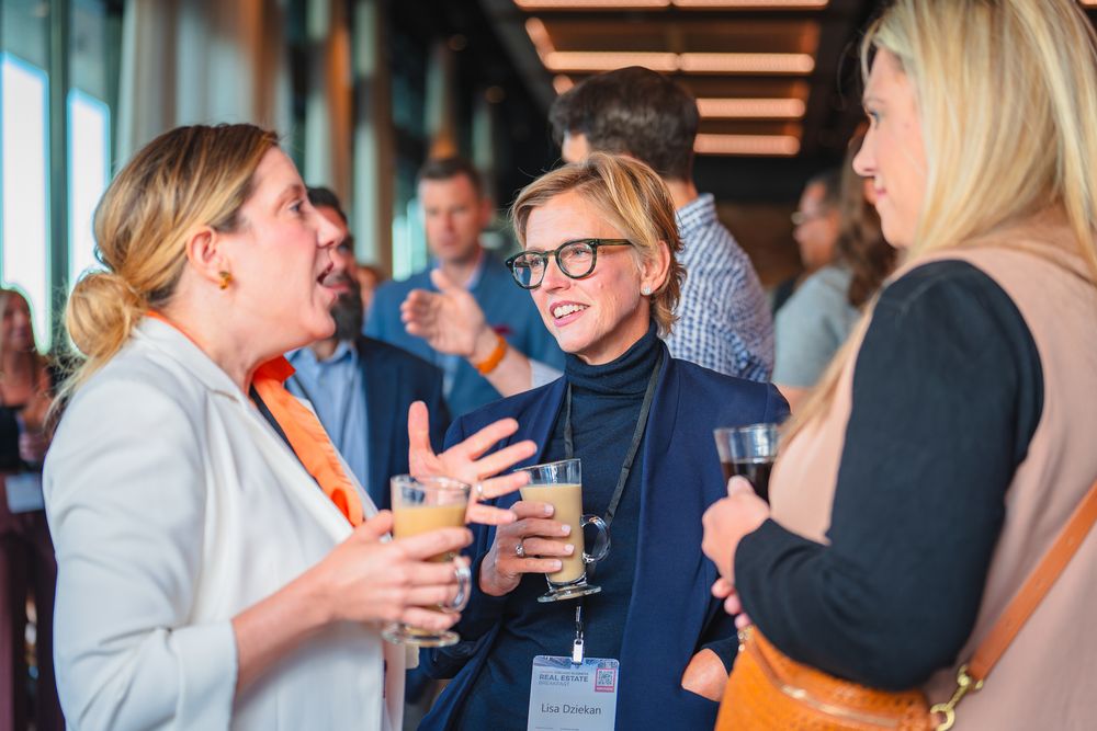 Business professionals socializing and networking at a corporate cocktail reception.