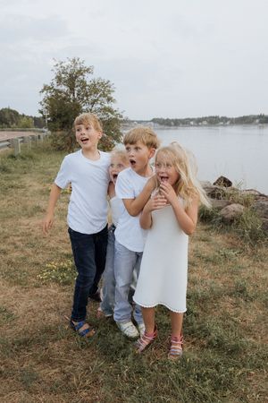 cousins playing during family session, family portrait photographer Moncton New Brunswick candid moment photography
