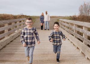 Brothers run towards camera in an outdoor fall family photoshoot in Dieppe New Brunswick, Moncton family photographer, family portraits