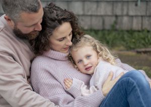 family cuddle on a cold October evening in Moncton New Brunswick, lifestyle family portraits in Dieppe NB, outdoor family photography