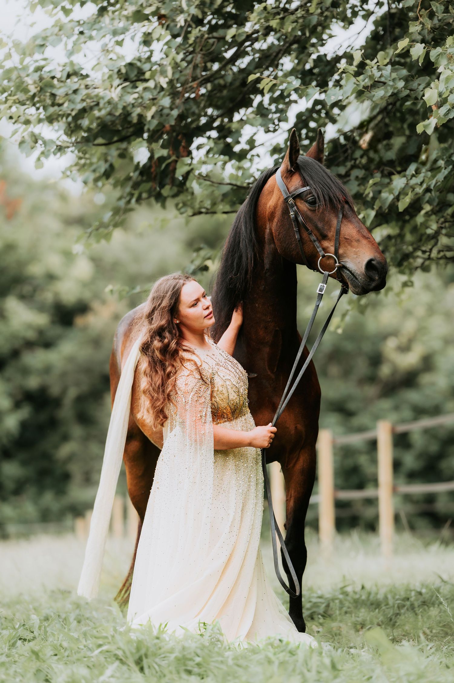 Dreamy wedding photo of owner with her bay horse.