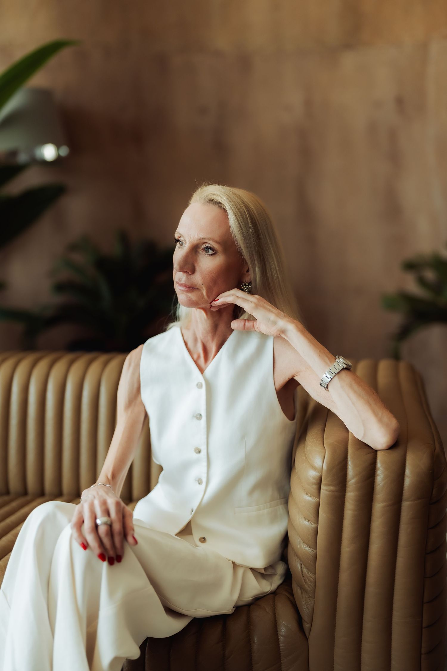 Studio personal branding photoshoot in Dubai – woman seated in studio, warm tones
