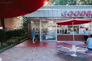 Vintage Goodberry's ice cream stand with red and white decor and outdoor seating on a brick patio.