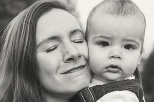 Black and white photo collage showing tender moments of affection and closeness between a parent and child.