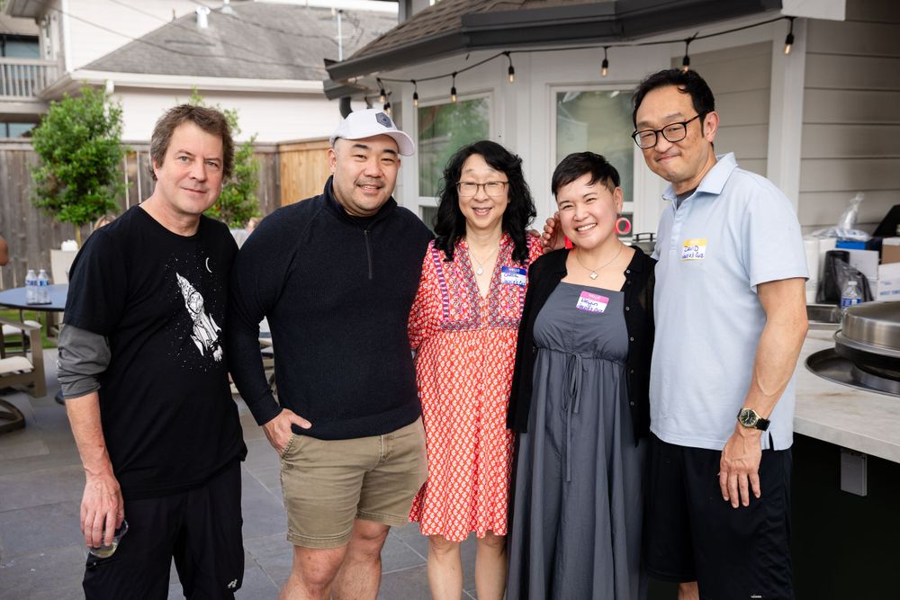 Group of friends gathering at casual backyard party.
