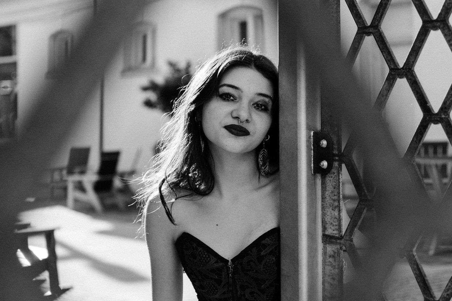 Black and white fashion portrait series featuring vintage-inspired glamour styling and dramatic lighting effects.