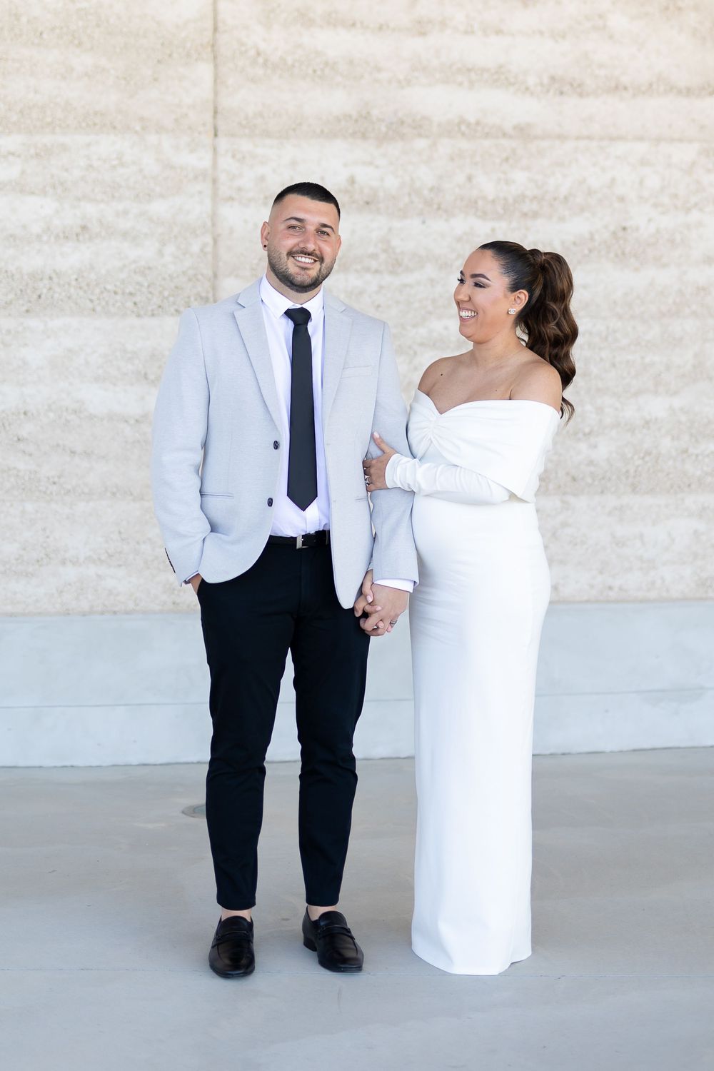 Natural candid portrait of newlyweds and maternity shoot and smiling after their wedding ceremony in Sydney