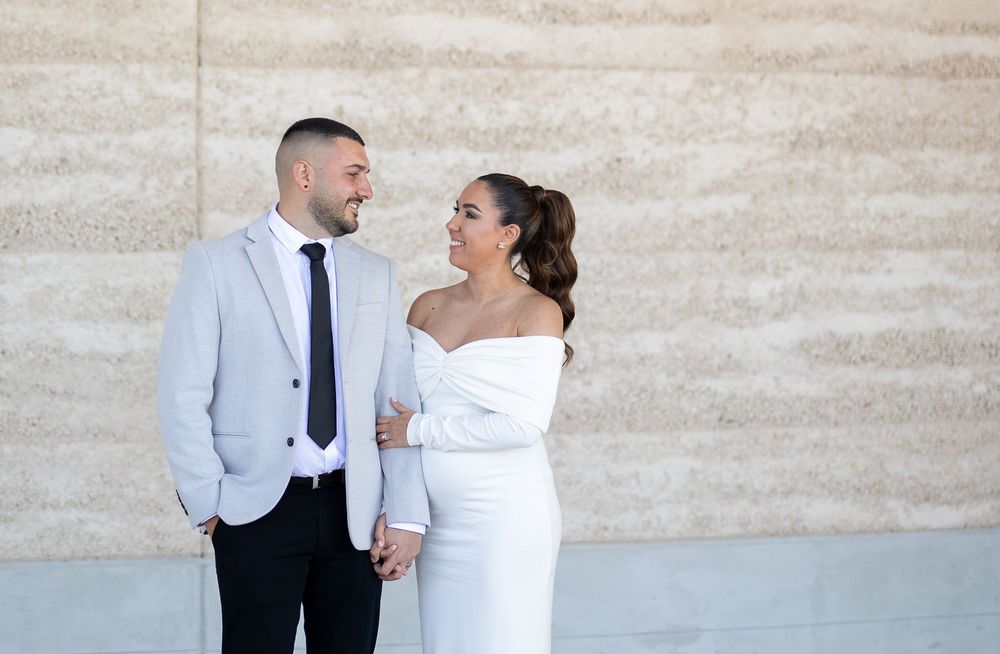 Natural candid portrait of newlyweds and maternity shoot and smiling after their wedding ceremony in Sydney
