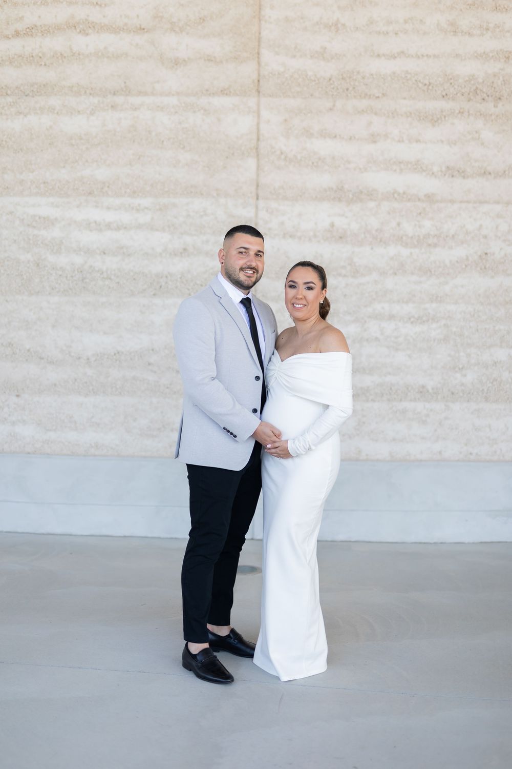 Natural candid portrait of newlyweds and maternity shoot and smiling after their wedding ceremony in Sydney