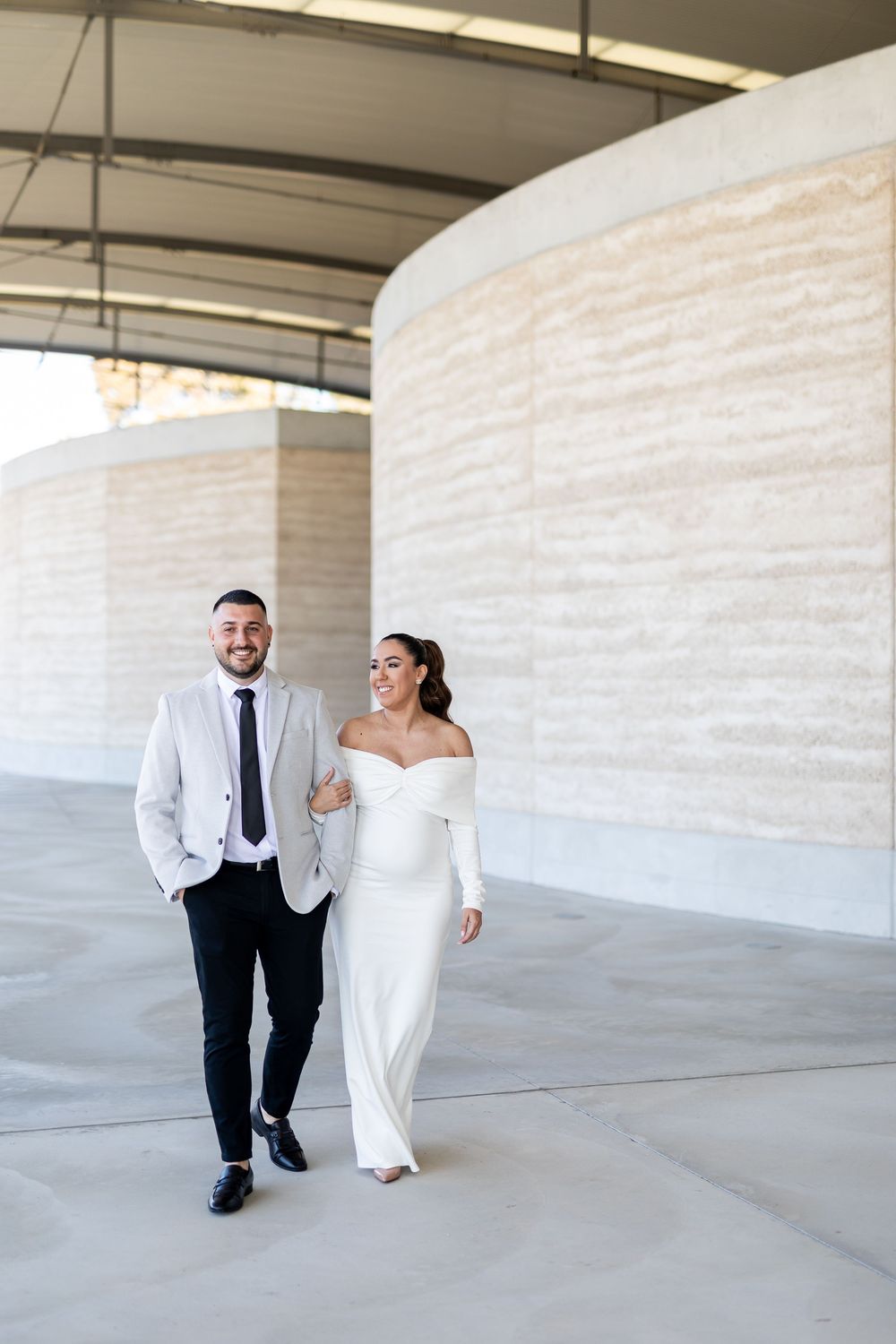 Natural candid portrait of newlyweds and maternity shoot and smiling after their wedding ceremony in Sydney