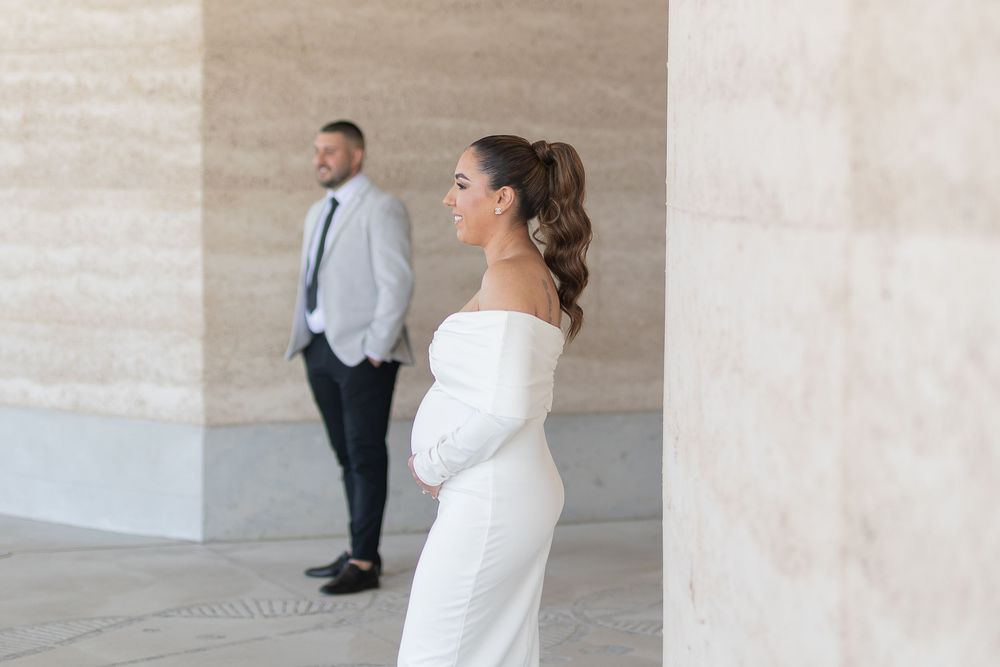 Natural and creative candid portrait of newlyweds and maternity shoot and smiling after their wedding ceremony in Sydney