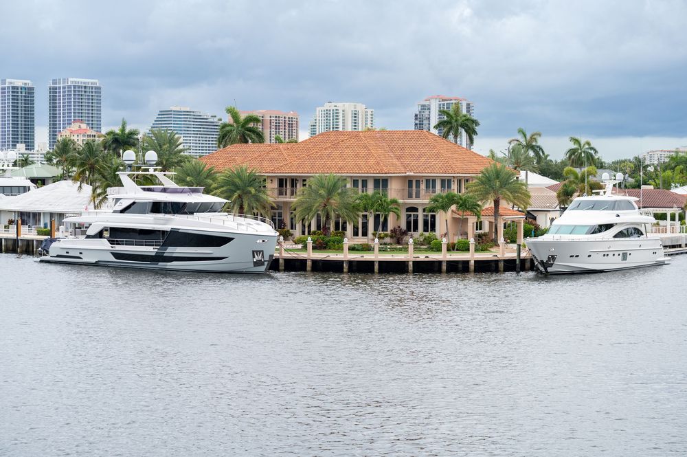 Wedding party posing with Fort Lauderdale skyline and yacht in background