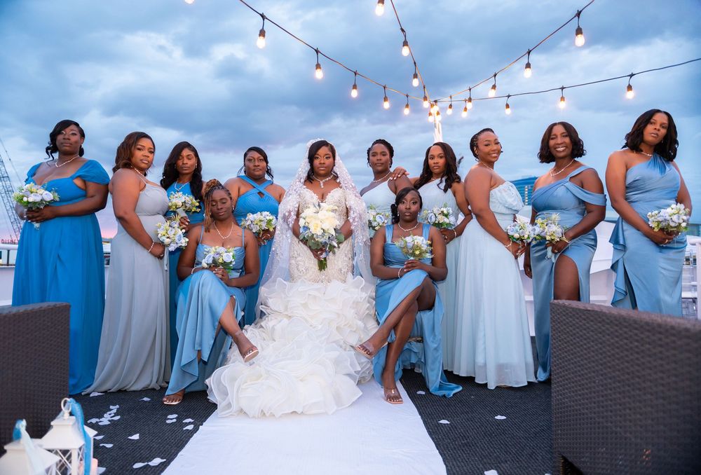 Ruffled fabric and coastal floral details on luxury yacht wedding tables