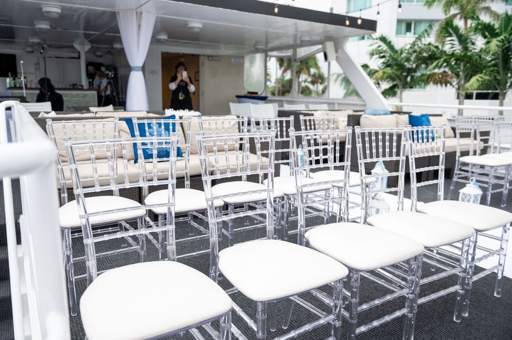 Guests laughing and enjoying cocktail hour at South Florida yacht wedding