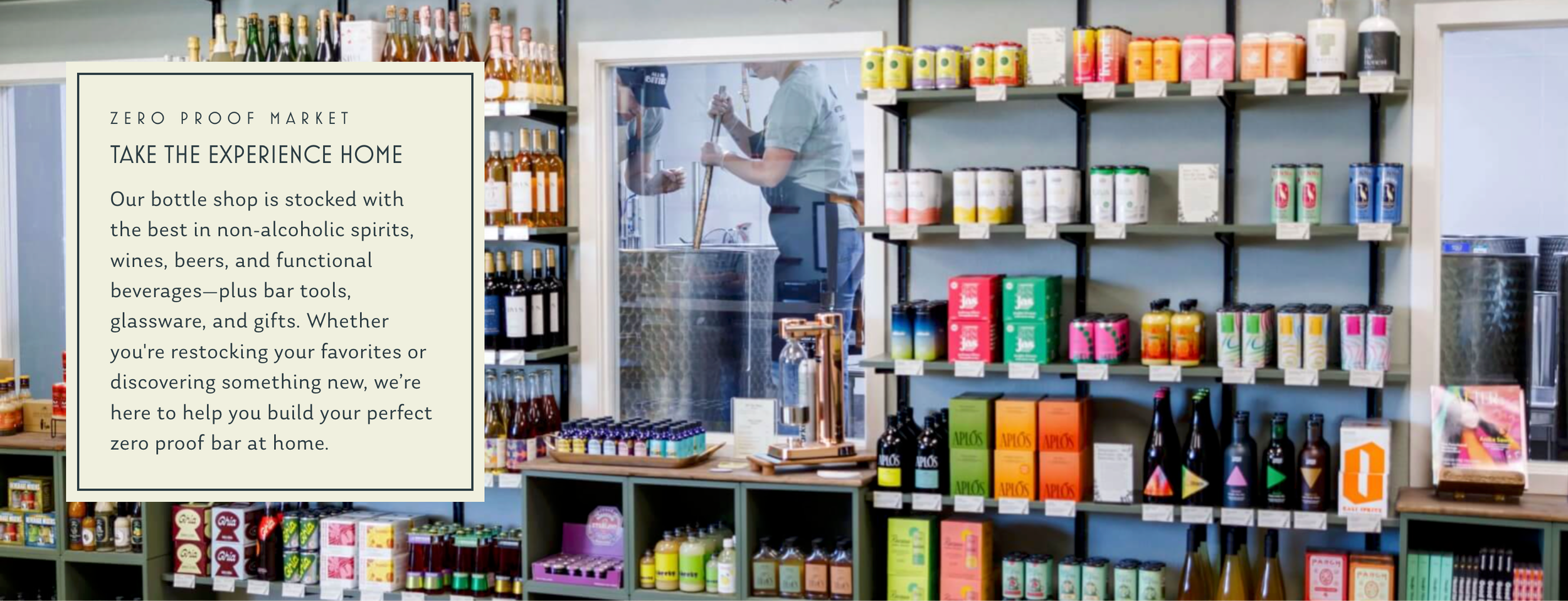 Shelves of colorful bottles and products line a wall in a retail store with informational signage displayed.