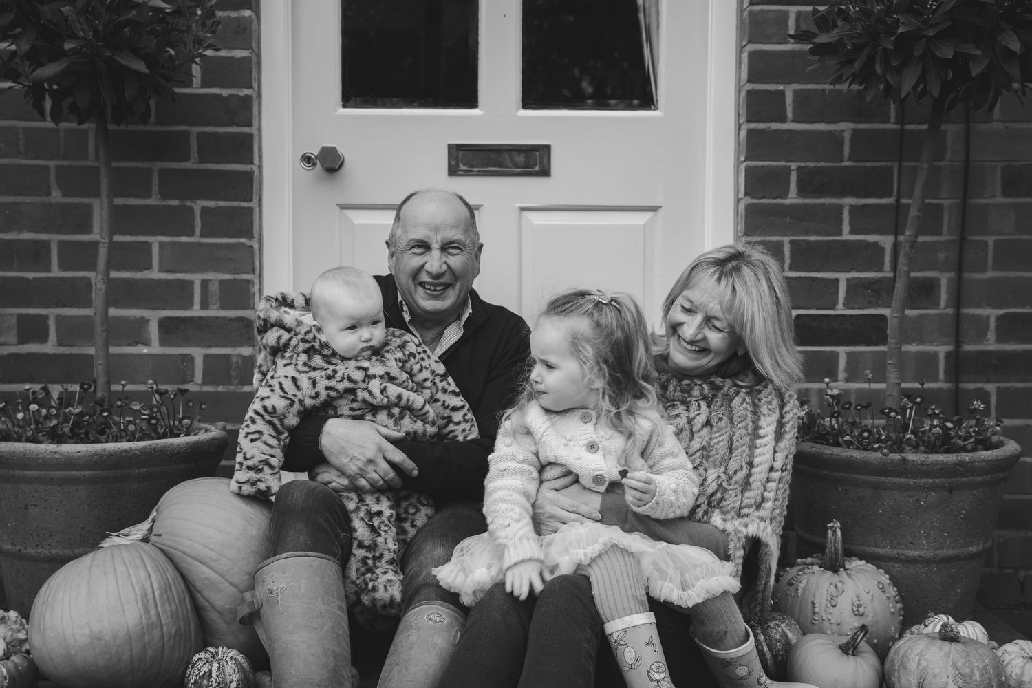 Family gathering outdoors with pumpkins and autumn decorations. Photographer. Hull. East Yorkshire. Photography