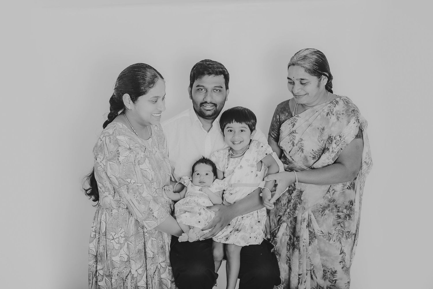 Family in floral outfits posing for black and white portrait. Photographer. Hull. East Yorkshire. Photography