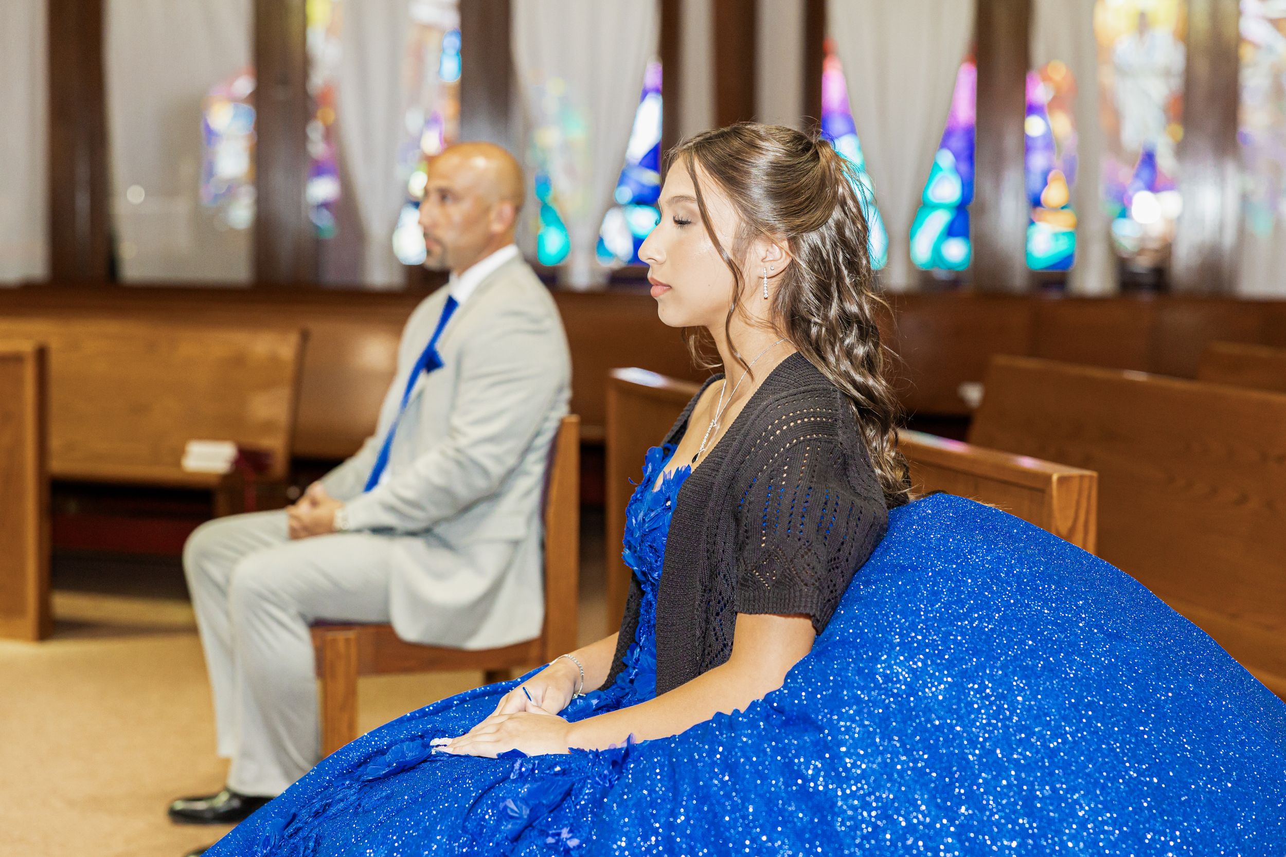 Celebration in church venue with blue sparkly decorations and mood lighting.