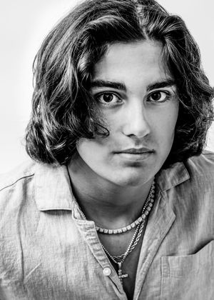 A series of black and white portrait photographs showing different facial expressions and poses in an artistic style.