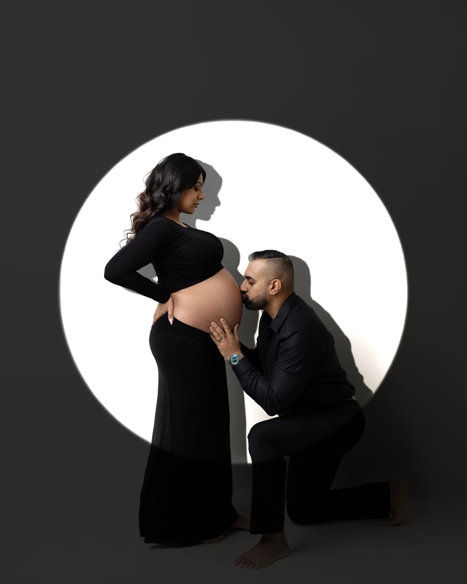 A series of minimalist maternity portraits showing a pregnant woman in a white dress against a neutral backdrop.