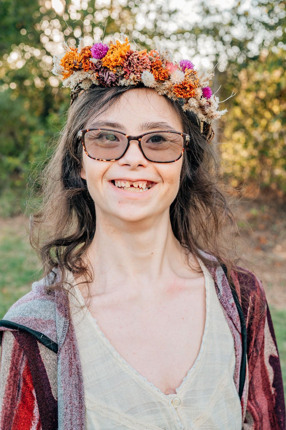 young woman with down syndrome smiling at camera during a inclusive family session in Fort Worth Texas