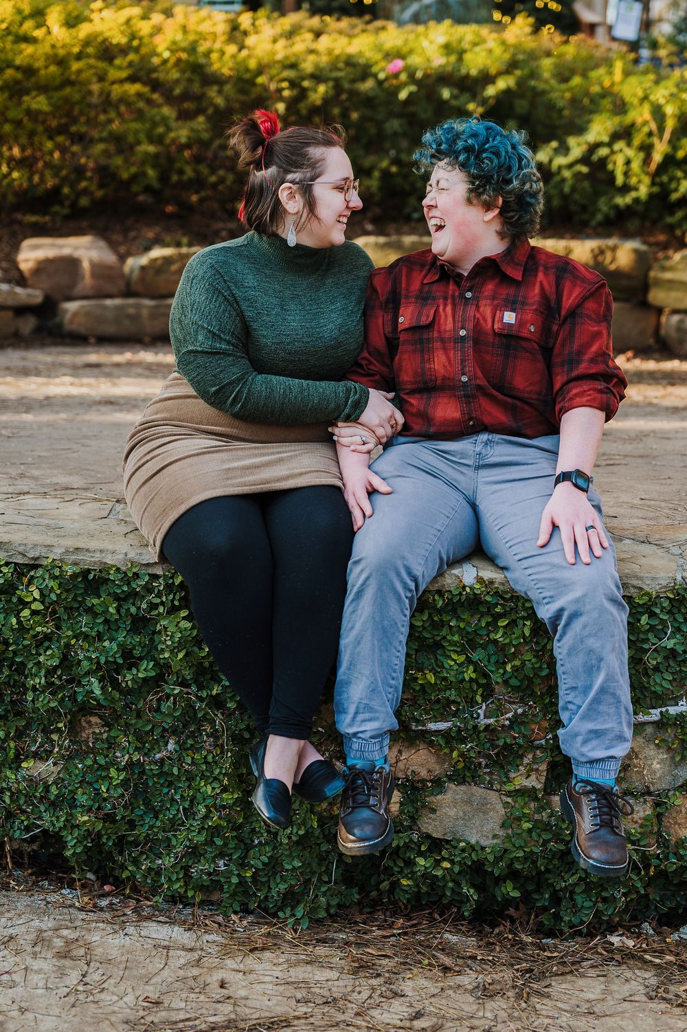 queer couple posing together during an outdoor maternity session in DFW Texas