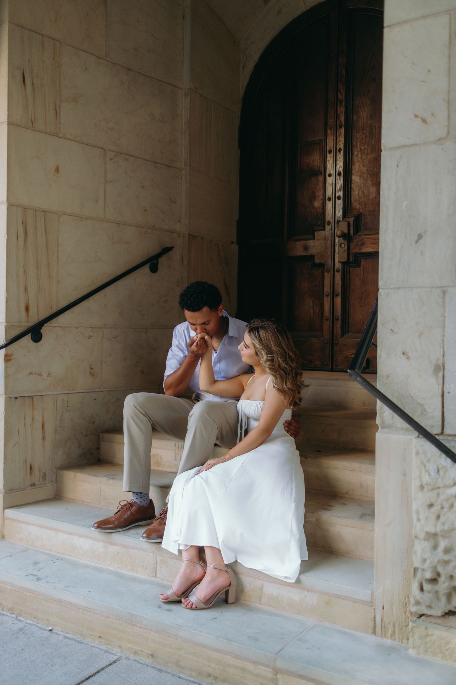 A romantic couple sits together on stone steps in a series of four progressive photos showing tender moments.