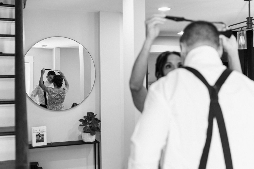 A series of black and white bathroom mirror selfie photographs arranged in a horizontal strip.